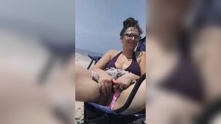 Milf gets super wet touching her hairy pussy at the public beach