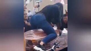 Sexy Bizarre Moment Woman TWERKS on top of coffin of his husband in front of cheering crowd