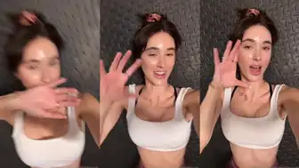 "Hot brunette itsnatalieroush flaunts her curves in a white sports bra"