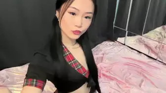 Hot Asian Girl in Plaid Outfit Teasing on Bed