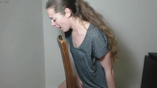 Teen horny girl finds a chair to masturbate and reaches a real orgasm