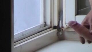 Roommate films girl giving handjob to her boyfriend by the window