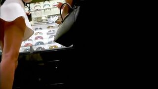 Awesome upskirt filmed by candid camera in public store