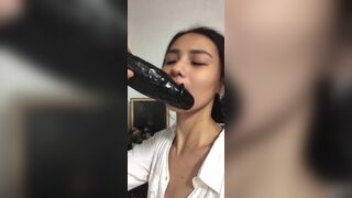 Horny Asian Teen Tries to Sucks a Big Dildo Video